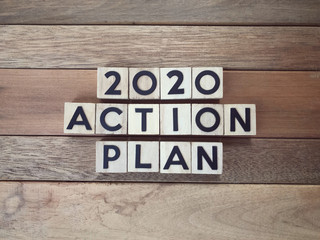 Fototapeta premium New Year Plan concept - 2020 Action Plan written on wooden blocks.