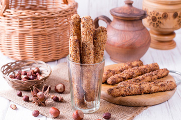 Nut cookies sticks on a wooden table