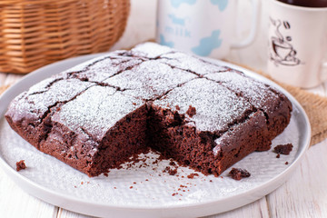 Homemade chocolate cake with icing sugar