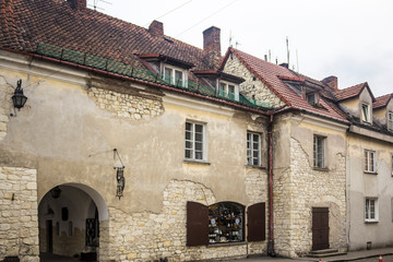 Fototapeta na wymiar Old stone houses on the market square. The walls are made of limestone. Kazimierz Dolny is a medieval city over the Vistula.