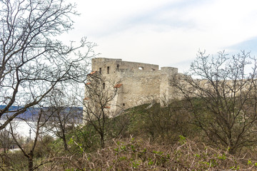 The ruins of an old castle on a hill. Built of limestone. Kazimierz Dolny is a medieval city over the Vistula.