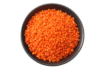 red lentils in black bowl isolated on white background. Top view.