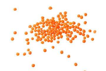 red lentils isolated on white background. Top view.