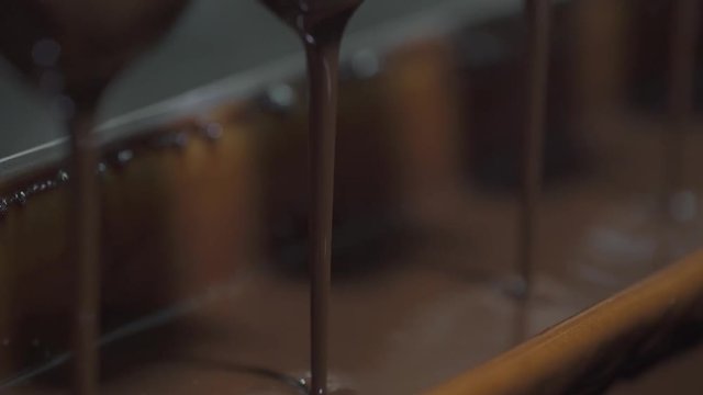 ice cream production, chocolate coating process on ice cream, production line, dairy products.