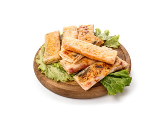 Wooden board with tasty fried spring rolls on white background