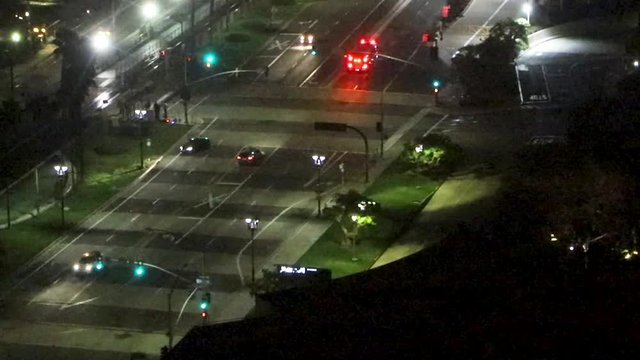 fire truck rushes down harbor drive in San Diego at night