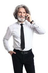 Handsome mature businessman talking by phone on white background