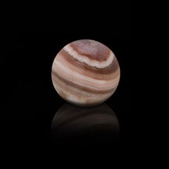 Jasper stone, planet Jupiter on a black background