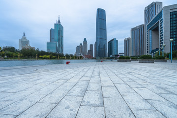 Fototapeta premium empty floor and city skyline under blue sky, tianjin, china.
