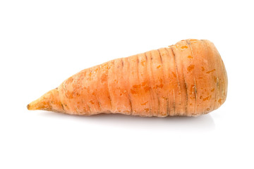 Ugly natural carrot isolated on white background