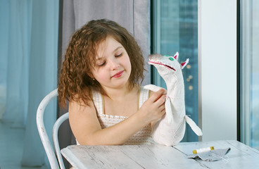 small girls with hand puppets