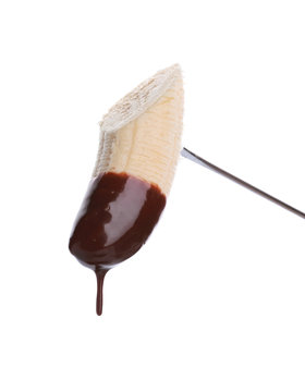 Fondue Stick With Chocolate Covered Banana On White Background