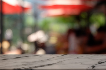 Empty rock table in front of abstract blurred bokeh background of restaurant . can be used for display or montage your products.Mock up for space.