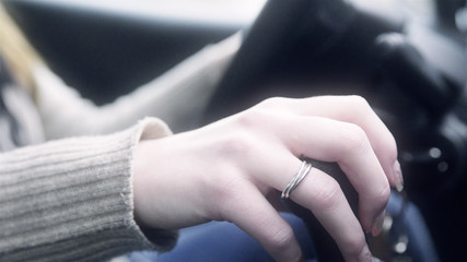 Fototapeta premium Female hand holding the gear stick