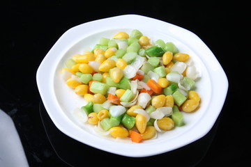 peas and carrots on a plate
