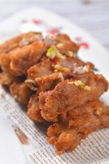 fried chicken with sauce on white plate