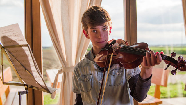 Boy Pose With Violin At Home