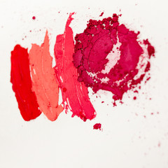 Lipstick and lip gloss, drops and strokes of different shades to create different images in makeup