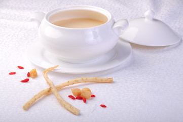 cup of tea and cookies on wooden background
