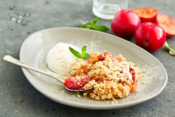 Plum crumble with almond crumb and ice cream.