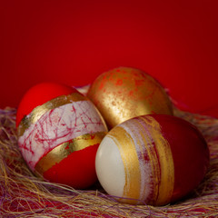 Success Easter Concept Golden Egg on Bright Red Background
