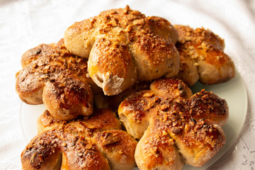 Freshly baked homemade buns with nut topping. Cocoa dough. Tasty, appetizing homemade cakes on a white background