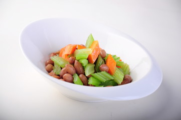 fresh vegetable salad in a bowl isolated on white