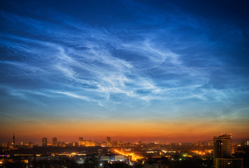Fototapeta premium Noctilucent clouds over Yekaterinburg city downtown at summer night