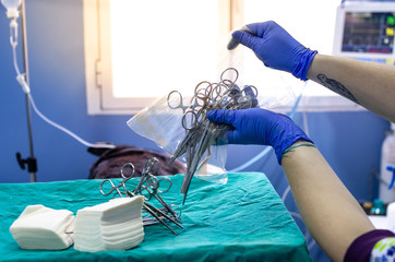 Opening of surgical sterile material before a surgery