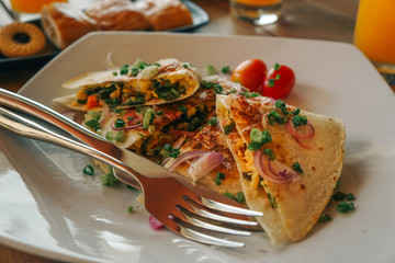 Breakfast dish with omelet sandwich 