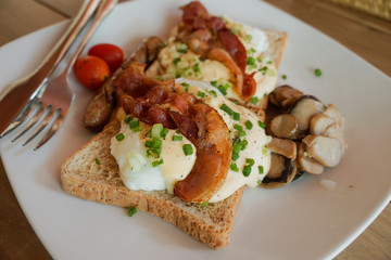 Toasted sandwich with bacon, tomato, egg and mushroom. top view