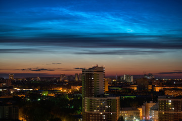 Fototapeta na wymiar Noctilucent clouds over Yekaterinburg city downtown at summer night