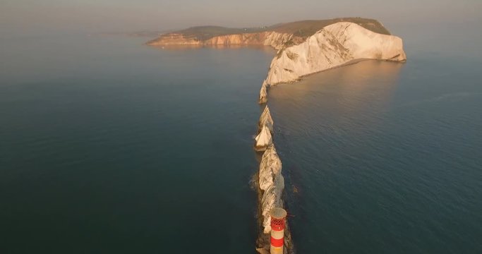4k Aerial footage of the Needles on the isle of wight in the solent during early sunset and golden hour.