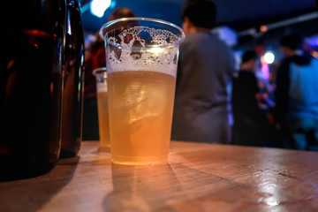 Draft beer.  Enjoying Evening Drinks at the pub party in a nightclub .