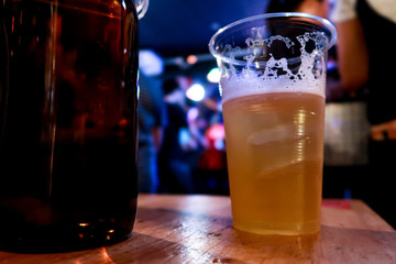 Draft beer.  Enjoying Evening Drinks at the pub party in a nightclub .