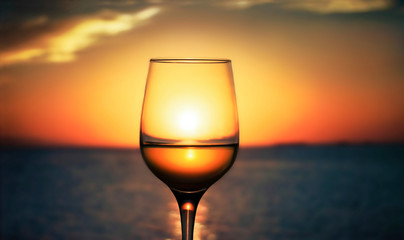glass of wine at sunset