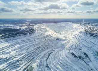 Naklejka na ściany i meble Asbest, Russia - May, 2018: Aerial panoramic shot of asbestos mining quarry at winter