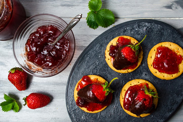 Strawberry dessert on a biscuit with jam
