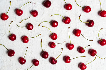 Obraz na płótnie Canvas Raw cherry fruits on a table flat lay