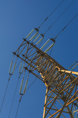 Electric pole with wires of high voltage against the sky.