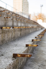 Abandoned rows of stadium without seats.