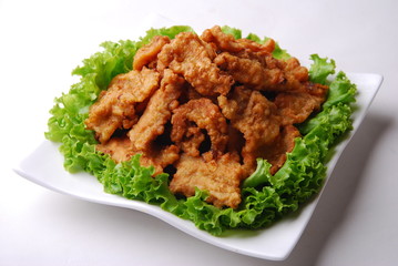 chicken with rice and vegetables on white plate