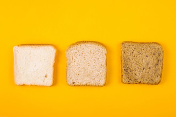 A selection of toast bread for breakfast. Minimalism on yellow