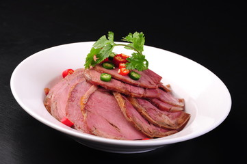 meat with vegetables on plate isolated on white