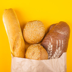 Buying fresh bread in a paper bag concept