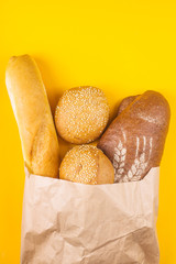 Buying fresh bread in a paper bag concept