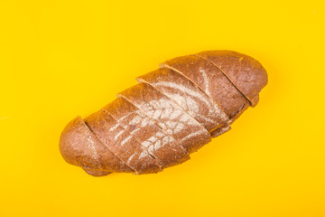 Sliced bread for dinner on a yellow background - minimalism