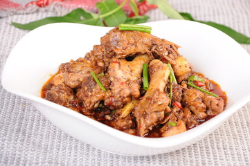 chicken with rice and vegetables on white plate
