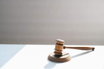  judge's wooden gavel on blurred background
