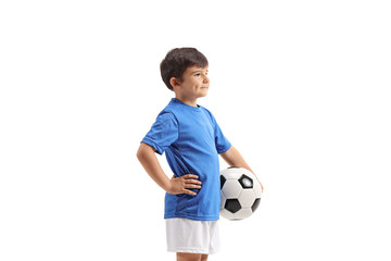 Little boy with a football standing